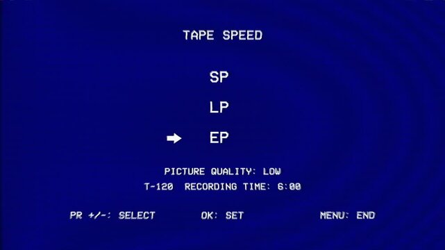 Retro VCR on-screen menu displays tape speed settings switching between SP, LP, and EP recording modes on blue static screen.