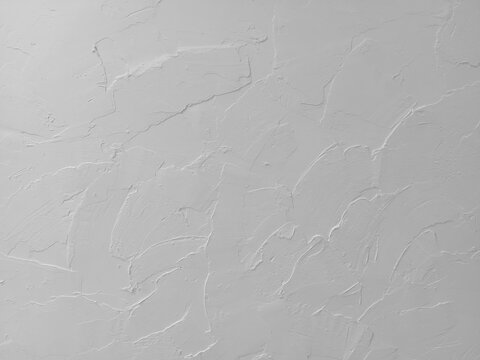 Texture of white plaster or stucco wall with visible trowel strokes. Ideal for minimalist background, concrete surface, interior design, space for text, and abstract concepts.