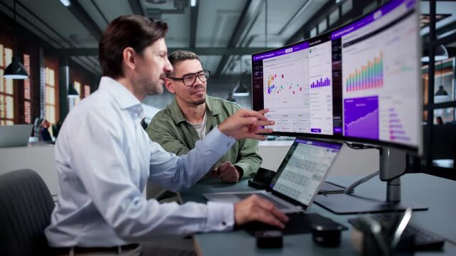 Social Media Managers Discuss Marketing Strategy Using Calendar
