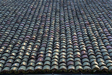 Roof of an old building, covered with old roof tiles © ceci
