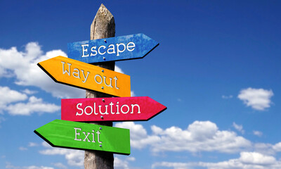 Escape, way out, solution, exit - wooden signpost with four arrows, sky with clouds © PX Media