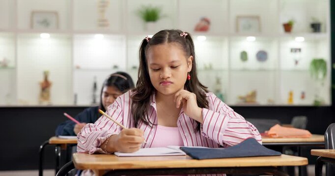Education, kid and thinking with test in classroom for academic assessment, knowledge or quiz. Exam, student learning and girl with solution in school, writing on book and multiple choice questions