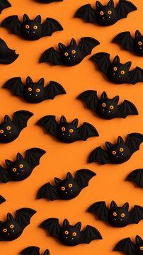top down view 3d cartoon Halloween black bat figures pattern isolated on a orange background
