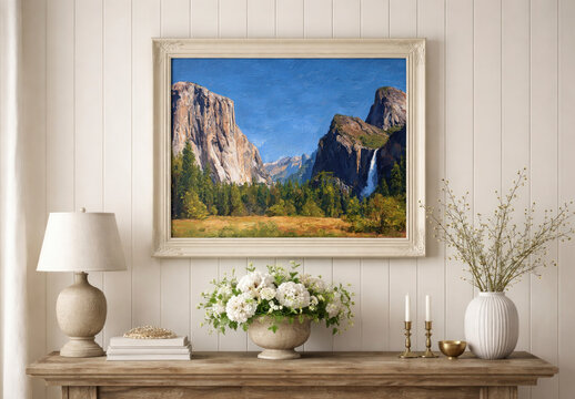 Framed Yosemite Landscape Artwork Above A Console Table With Flowers
