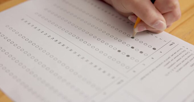 Hand, writing and exam in high school with multiple choice, problem solving and quiz for education. Girl, student and circle solution in class for question paper, learning and knowledge assessment.
