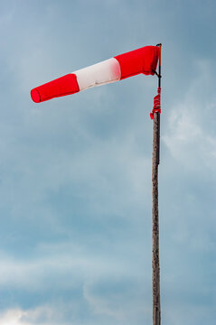 Windsock showing wind direction and speed against sky