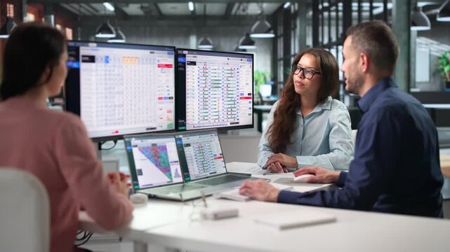 Travel Agents Collaborate On Airline Reservation System Using Laptop