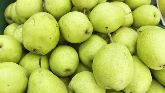Close up of fresh yellow pears background