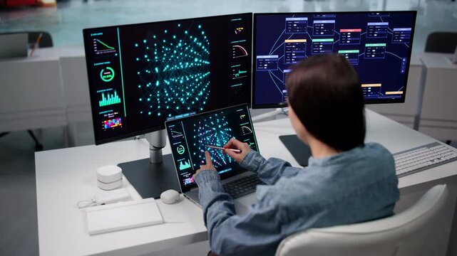 Data Scientist Analyzes Machine Learning Model Using Laptop