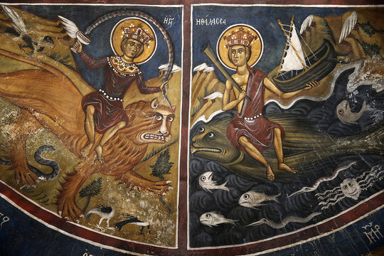 Byzantine fresco at the Panagia tis Asinou Church in Nikitari, Cyprus, depicting two crowned figures riding a lion and a sea monster, surrounded by fish, a ship, and Greek inscriptions.