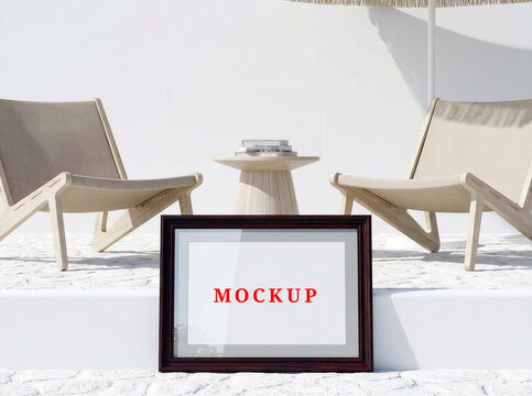 Blank white horizontal wooden frame mockup on minimalist living room gallery wall.