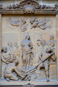 St. Vincent Basilica, Metz, Moselle, France. This bas-relief carved in stone depicts the martyrdom of a saint bound to a stake, surrounded by executioners.