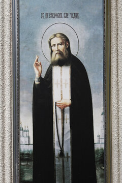 A framed Orthodox icon depicting Saint Seraphim of Sarov giving a blessing, holding a rosary in front of churches, at the Japca Monastery in Moldova.