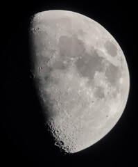 Waxing gibbous moon close up against dark night sky background © Anastasiia