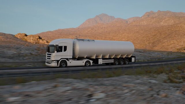 A moving camera arcs from the front three-quarter view to the side of a white tanker truck while it drives through a rugged, sunlit desert landscape.