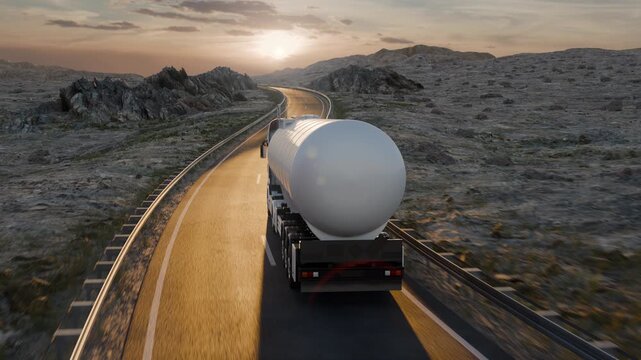 An elevated camera shifts from one side of a white tanker truck to the other while following it from behind on a winding road toward the low evening sun.