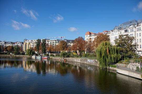 Berlin, Germany; 1st October 2025: Autumn waterfront along the Spree in Berlin's Moabit district with boats and riverside apartments.