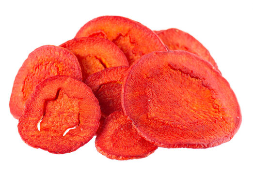 Crispy roasted carrot chips with sea salt, isolated on white background. Healthy and crunchy natural vegetable snack. Clipping path.