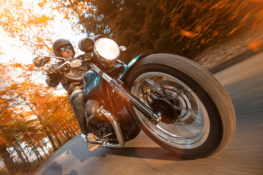 Motorcycle Riding Fast on an Autumn Road with Motion Blur