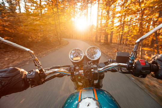 Motorcycle Riding Fast on an Autumn Road with Motion Blur