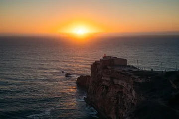 Forte de São Miguel Arcanjo at sunset, Nazaré, Portugal © JFL Photography