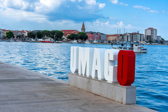 Umago waterfront sign overlooking historic harbor in Umag Croatia