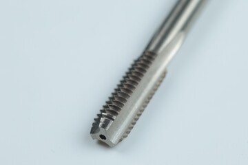 Fototapeta premium a metal-cutting tool designed for cutting or restoring internal threads in pre-drilled holes