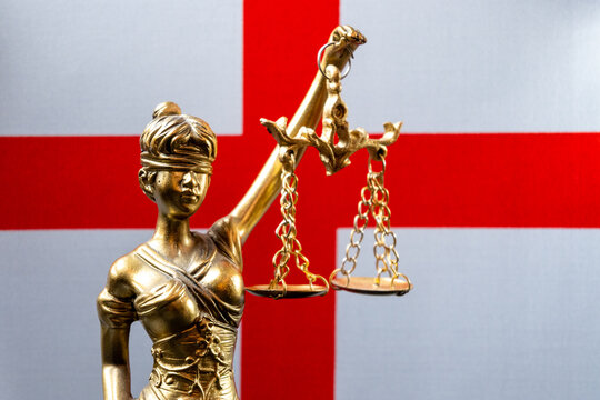 Lady Justice Statue Against England Flag