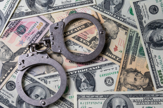 Handcuffs on US Dollar Banknotes
