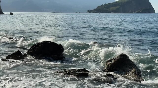 Rolling Sea Wave Breaking on Dark Coastal Rocks by Green Island