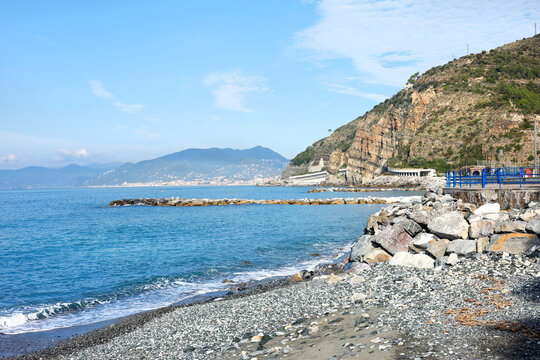 Pebble beach Sestri Levante Italian Riviera sea waves cliff. Coastal wilderness calm Mediterranean nature secluded shore. Eco tourism coastal wellness outdoor park.