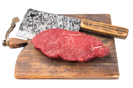 Raw beef sirloin tip knuckle meat with cleaver knife on wooden cutting board. Fresh lean butcher cut prepared for cooking on rustic background
