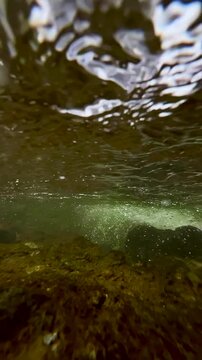 Fallbach mountain waterfall in Austria. The camera is submerged under the water