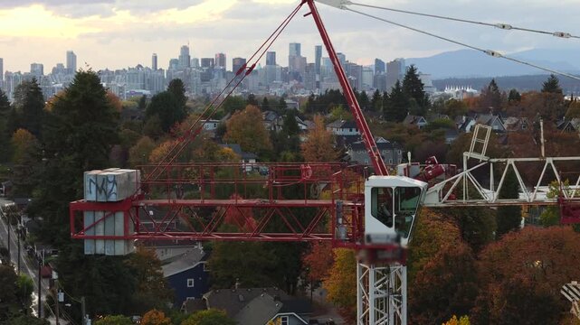 Construction crane over a vibrant city skyline. Vancouver, Canada