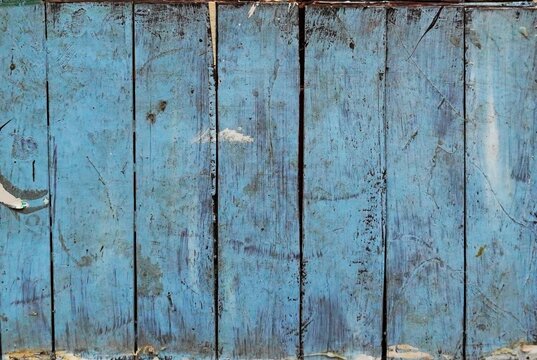 Old Blue Painted Wooden Planks with Weathered Peeling Paint &ndash; Rustic Fence Texture Background