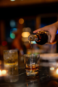 Closeup businessmen holding a glass of whiskey