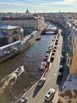 Aerial view of canal with boats and historic buildings in Saint Petersburg