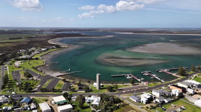 Port Albert, Victoria, Australia &ndash; 4K aerial drone view of historic coastal town, turquoise tidal waterways, marina, extensive sandbars and wetlands along the Gippsland coastline