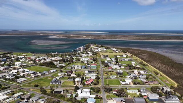Port Albert, Victoria, Australia &ndash; 4K aerial drone view of historic coastal town, turquoise tidal waterways, marina, extensive sandbars and wetlands along the Gippsland coastline