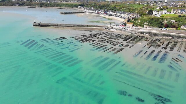 Aerial view of oyster aquaculture facilities in Brittany, France, capturing shellfish production on the intertidal coast