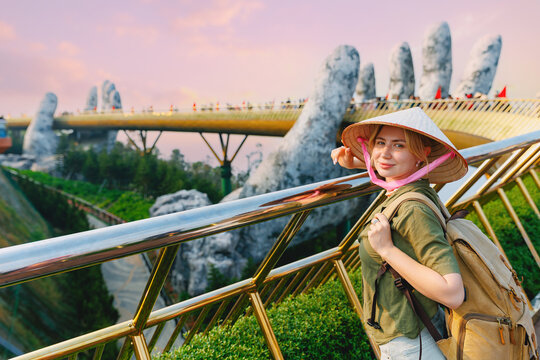 Caucasian female tourist at ba na hills golden bridge, Da nang Vietnam