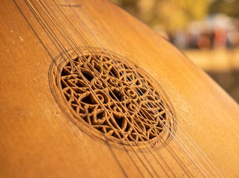 Detailed View Of Carved Rosette Soundhole On Vintage Acoustic Lute