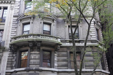Old New York City apartment buildings with ornate decorative stonework © Spiroview Inc.