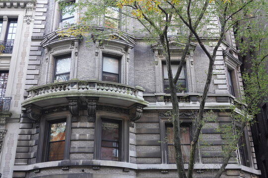 Old New York City apartment buildings with ornate decorative stonework