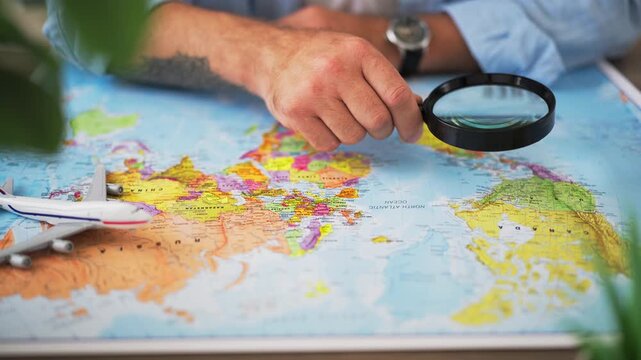 Man examine Caribbean Basin on map through magnifying glass, illustrating Caribbean geopolitics, US foreign policy, regional security, international relations, strategic interests,global trade routes
