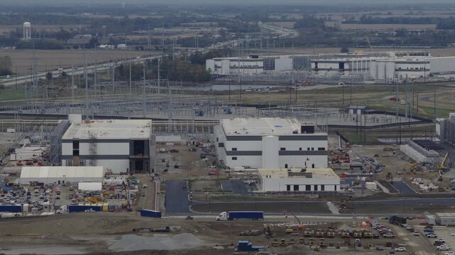Aerial view of hyper scale data center and building centers with electrical substation and construction by interstate 71 i71 highway between Columbus and Cincinnati Ohio for big technology company AI