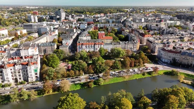 Aerial view of Wrocław city moat with autumn trees, Podwale street and historic tenement houses in city center, Poland