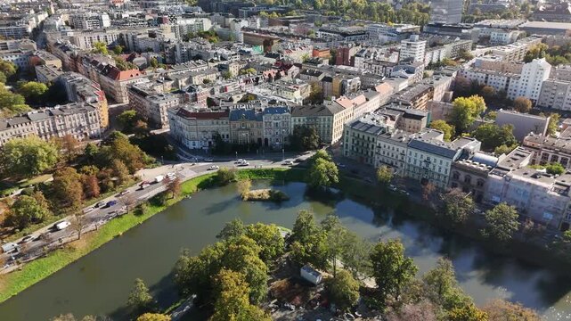 Aerial view of historic tenement houses along Wrocław city moat with autumn trees and Podwale street, Poland