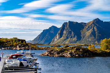 Boats moored at the pier in the scenic harbor of Valberg Batforening in Finnhamn, Lofoten © EKH-Pictures