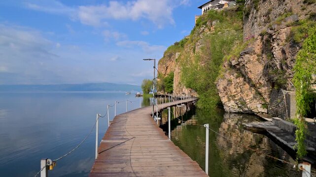 Walking along the wooden boardwalk on Lake Ohrid, Macedonia